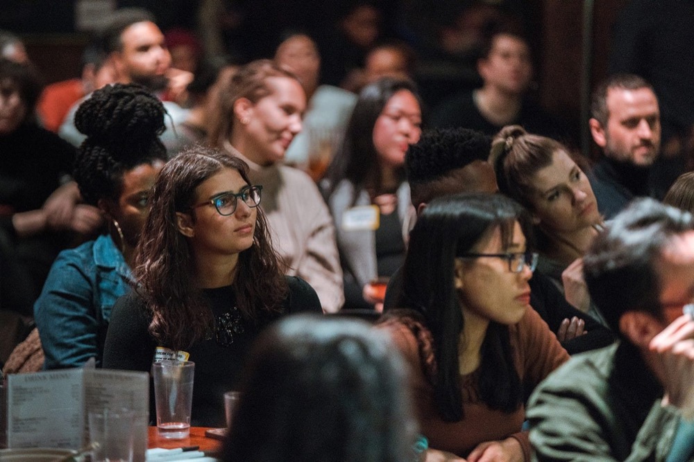 Audience members listening intently