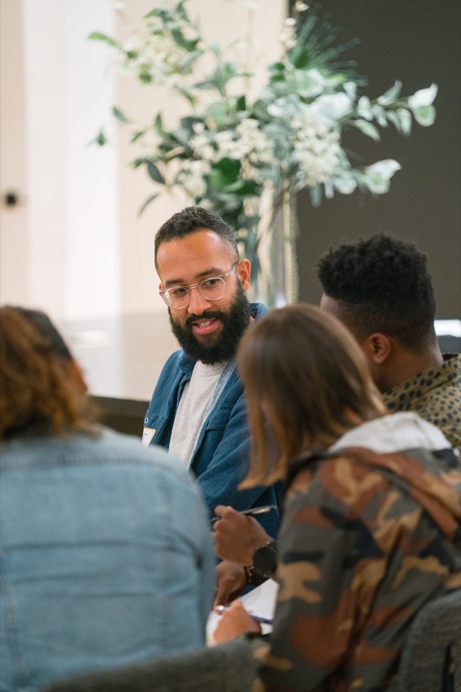 Two attendees talking in a breakout session