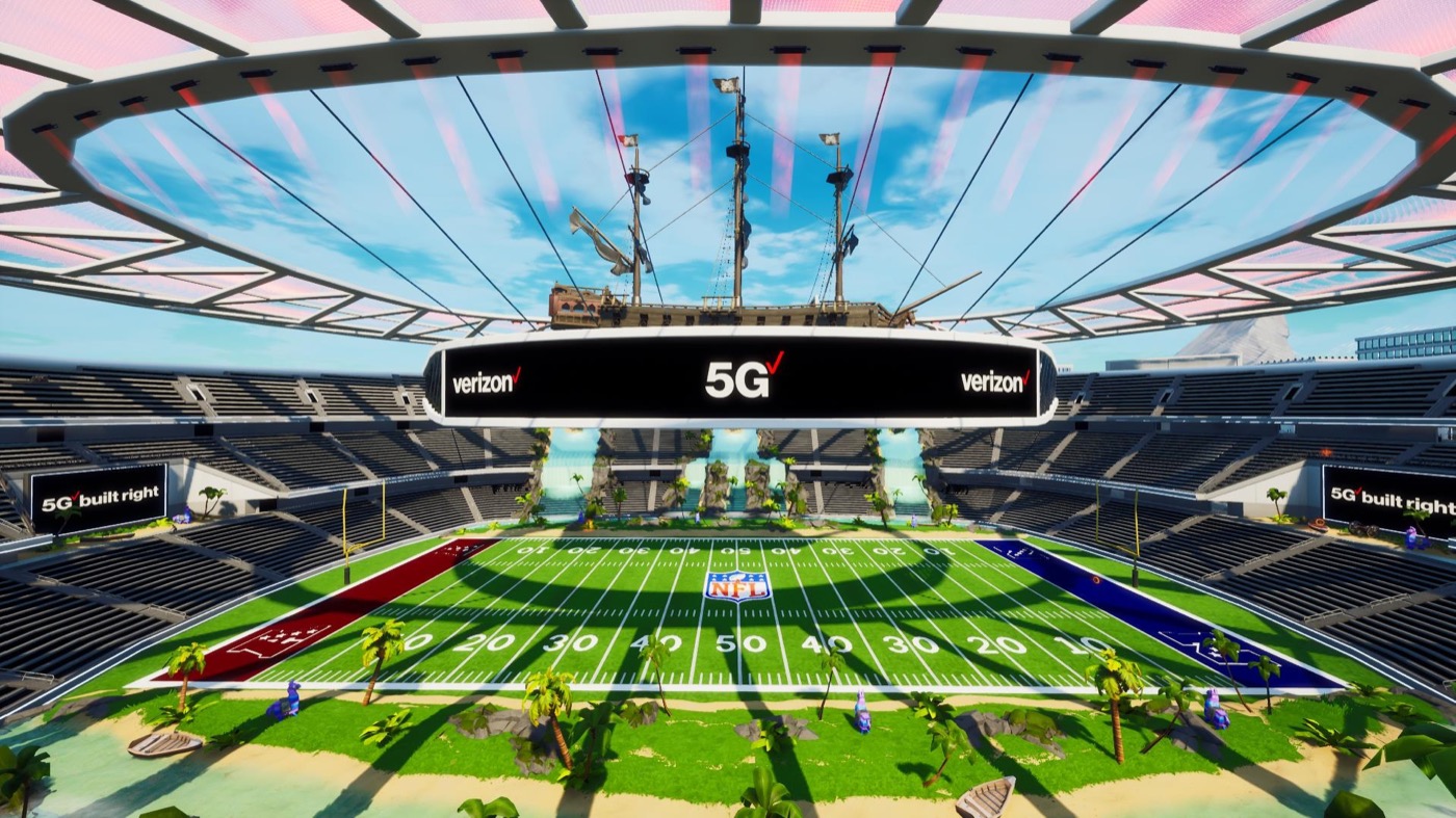 A Verizon 5G stadium built inside Fortnite, with an NFL field, palm trees and a pirate ship overhead